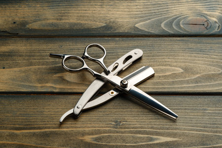Hairdressing professional scissors on wooden background close upの写真素材