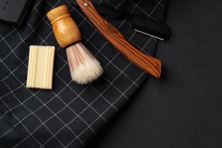 Traditional Wet Shaving Gear Arranged on a Dark Background With Morning Lightの写真素材