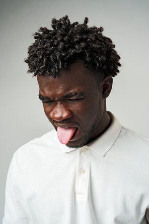Man Sticking Out Tongue and Making Funny Faceの写真素材