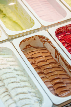 Colorful Assortment of Gelato Flavors in a Display Case at an Italian Ice Cream Shopの写真素材