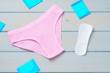 Top view womens underwear panties on a wooden background.の写真素材