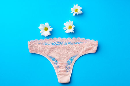 Womens panties with flower buds on paper backgroundの写真素材