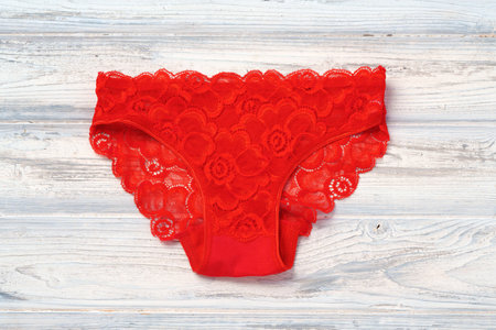 Top view womens underwear panties on a wooden background.の写真素材