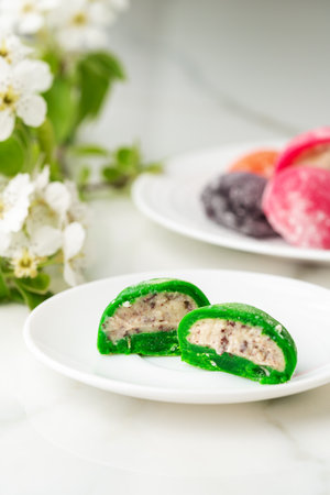Multi-colored Japanese cakes Mochi in a white plate