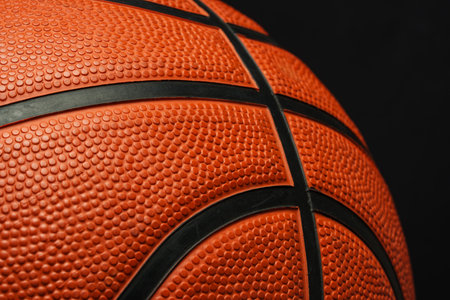 Close Up of Basketball on Black Backgroundの写真素材