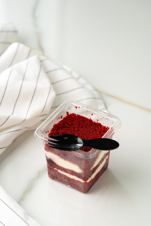 Trifle red velvet in plastic cup on tableの写真素材