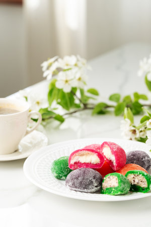 Multi-colored Japanese cakes Mochi in a white plateの写真素材