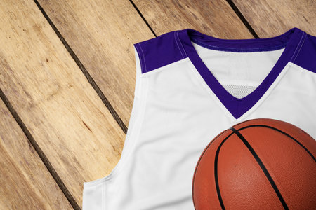 Basketball uniform on wooden background top viewの写真素材