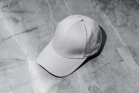 Baseball cap on gray background studio shotの写真素材