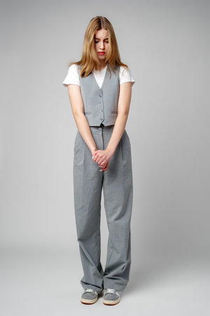 Young Woman Exhibiting a Pensive Sad Expression in a Studioの写真素材