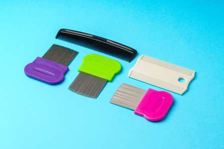 Comb for lice removing on blue backgroundの写真素材