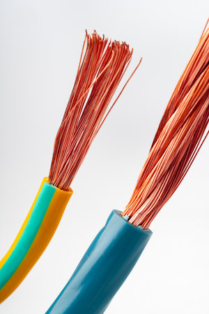 Various Electrical Wires With Exposed Copper Strands on White Background