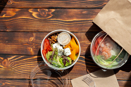 Take out poke bowl on wooden background