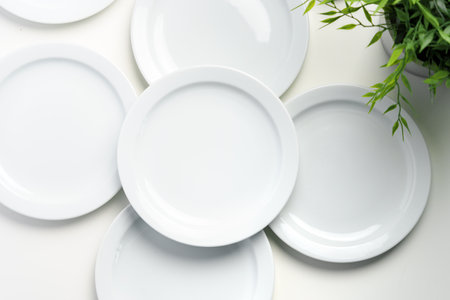 Set of white dinner plates on white backgroundの写真素材