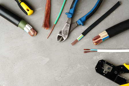 Electrical Tools and Wires on Gray Surfaceの写真素材