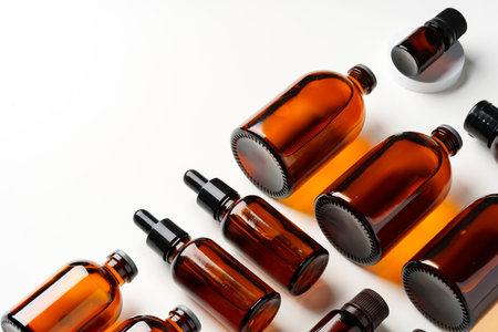 Mock up of amber glass bottles on white background flat layの写真素材