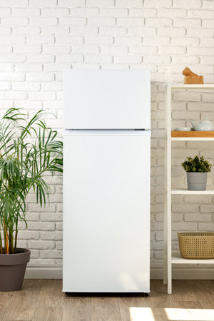 White Refrigerator In A Modern Kitchen With Brick Wallの写真素材