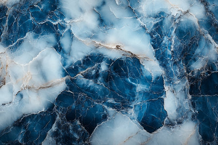 Textured blue marble surface with white veins, showcasing natural patterns and huesの素材