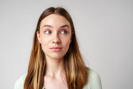 Young Woman With Long Brown Hair and Blue Eyesの写真素材
