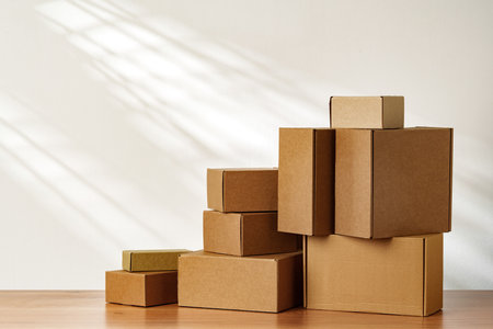 Stacked Cardboard Boxes On Wooden Surface In Sunlight