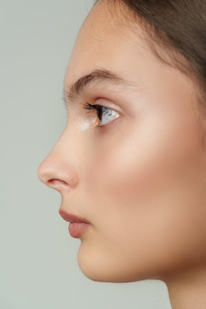 Close Up Profile Portrait of Young Woman With Soft Makeupの写真素材