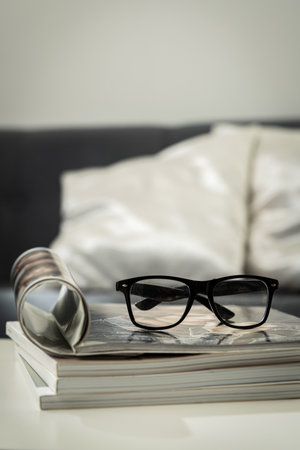 Stack of Magazines on White End Table in Living Roomの写真素材