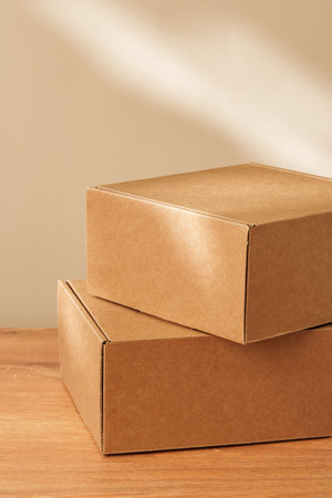 Some Cardboard Boxes on a Wooden Tableの写真素材