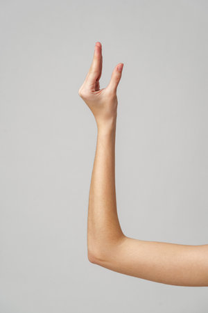 Close Up of a Womans Arm Extended Upwardの写真素材