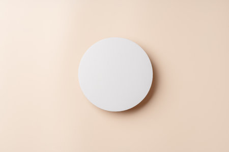 Simple Design With Two White Circular Shapes Against a Soft Beige Background in Modern Interior...