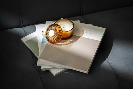 Amber Glass Candle Jar and Magazine on the couch