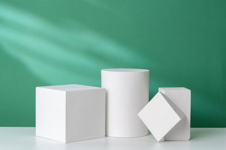 Simple geometric shapes on a green background with soft lightingの写真素材