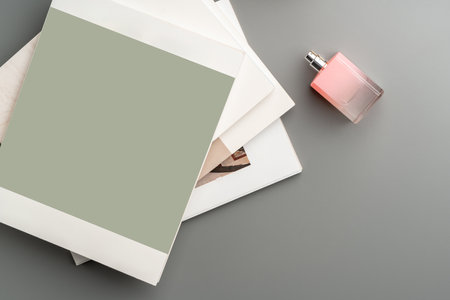 Creative workspace arrangement featuring stationery, accessories, and ambient lighting on a stylish tableの写真素材