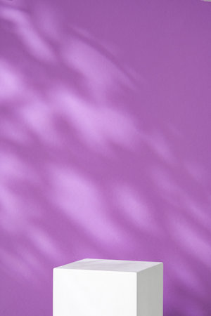 White geometric shapes against a soft purple background with gentle shadowsの写真素材