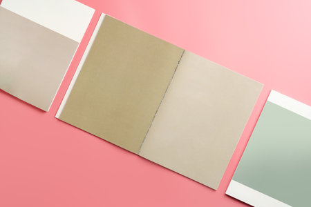 A Collection of Blank Papers Stacked on a Pink Surface for Creative Projectsの写真素材