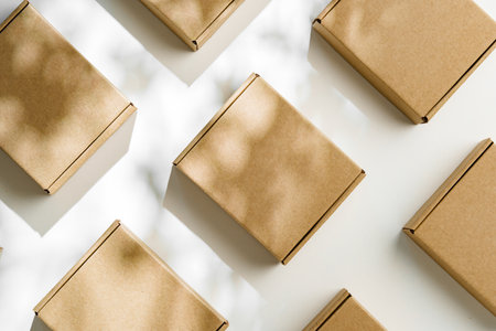 Brown cardboard boxes arranged on a light surface for packing goods in a warehouse setting