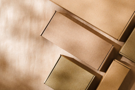 Brown cardboard boxes arranged on a neutral background during daylight hoursの写真素材