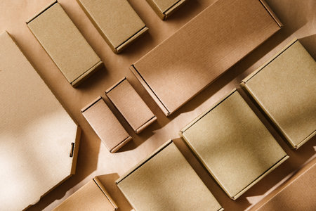 Multiple cardboard boxes arranged on a surface for packaging and shipping in a warehouse settingの写真素材