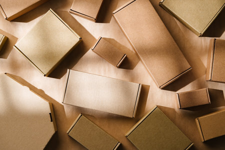 Multiple cardboard boxes arranged on a surface for packaging and shipping in a warehouse settingの写真素材