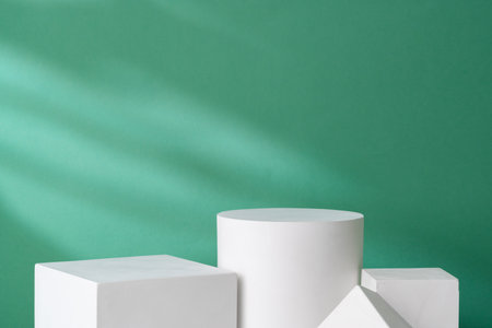 Simple geometric shapes on a green background with soft lightingの写真素材