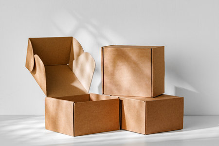 Display of brown cardboard boxes arranged uniquely with one box opened