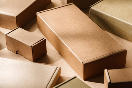 Multiple cardboard boxes arranged on a surface for packaging and shipping in a warehouse settingの写真素材