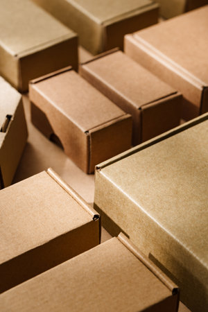 Multiple cardboard boxes arranged on a surface for packaging and shipping in a warehouse settingの写真素材