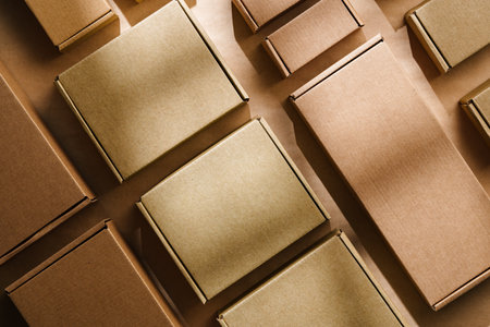 Multiple cardboard boxes arranged on a surface for packaging and shipping in a warehouse setting