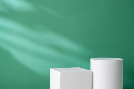 Simple geometric shapes on a teal background with soft lightingの写真素材