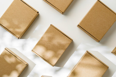 Brown cardboard boxes arranged on a light surface for packing goods in a warehouse setting