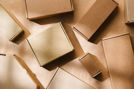 Multiple cardboard boxes arranged on a surface for packaging and shipping in a warehouse settingの写真素材