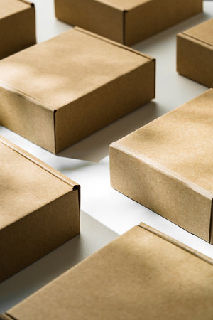 Brown cardboard boxes arranged on a light surface for packing goods in a warehouse setting
