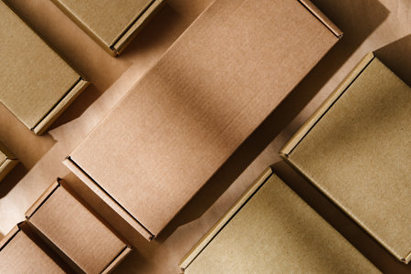 Multiple cardboard boxes arranged on a surface for packaging and shipping in a warehouse settingの写真素材