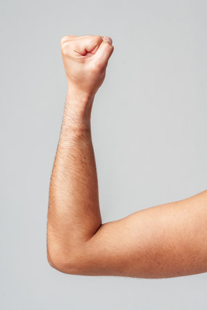 A person hand gesture against a neutral backgroundの写真素材