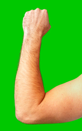 human arm gesturing with raised fingers against a bright green backdropの写真素材